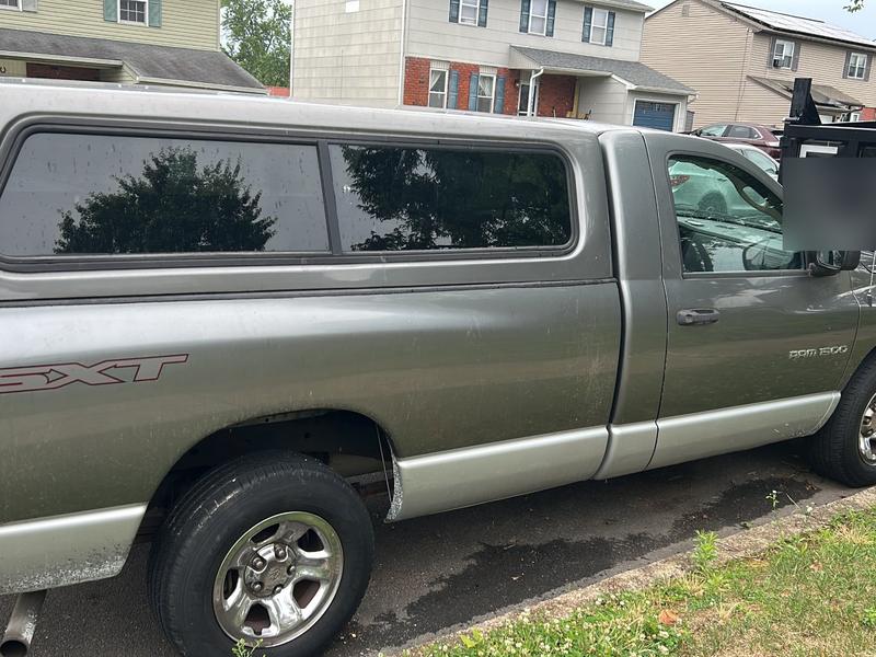 Gray Dodge Ram 1500 pickup with a bed cap bought by Try Auto Way, car buyer in Princeton NJ