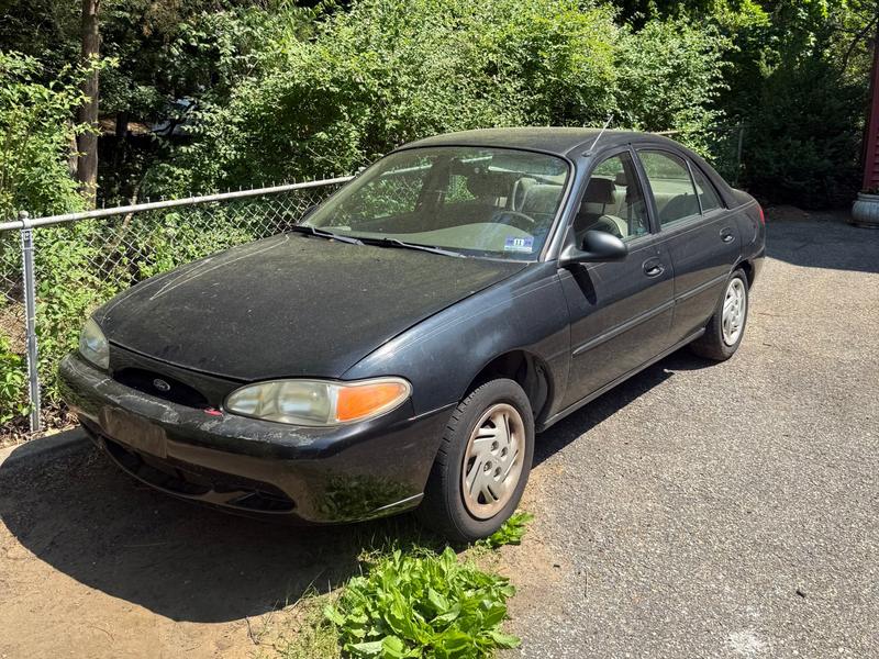 Dark Ford Escort sedan bought by Try Auto Way, car buyer in Princeton NJ