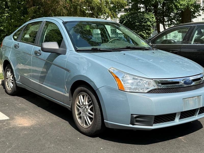 Light blue Ford Focus sedan bought by Try Auto Way, car buyer in Princeton NJ
