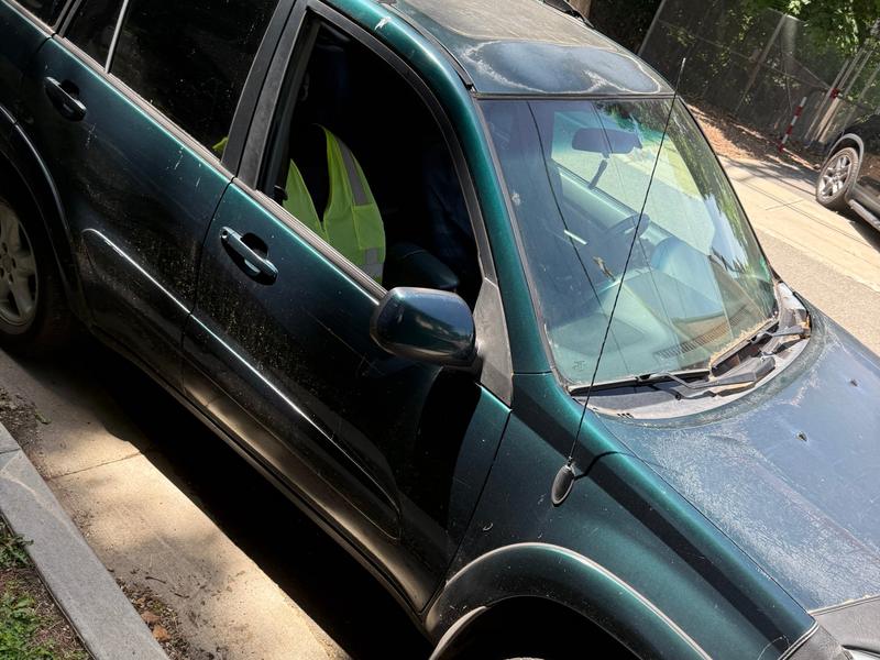 Green Toyota RAV4 parked at a curb bought by Try Auto Way, car buyer in Princeton NJ